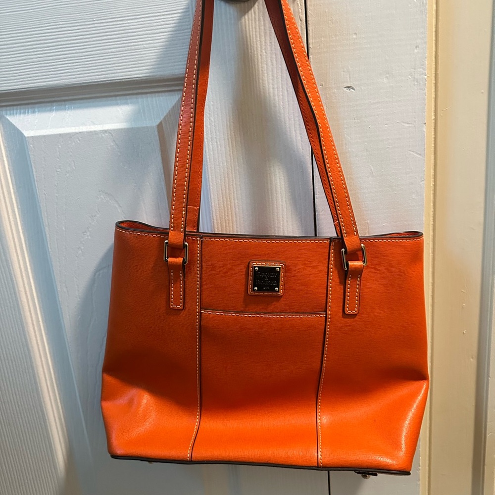 Dooney and Burke Orange Shoulder Bag with Minimalist Design and Metallic Emblem
